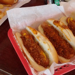 Chili dogs with mustard and fries..... Chili dogs with mustard and fries.....