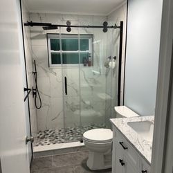 Kevin Lovely's Plumbing - Recent bathroom renovation with shower, vanity, and toilet plumbed by Kevin Lovely.