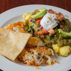 The Gilbert House - One of our signature dishes: green chili omelet, served with hash browns and a tortilla.