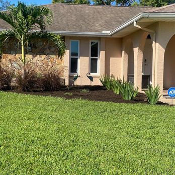 Lawn Spa - the front of a home with landscaping - Lawn Services Near Me