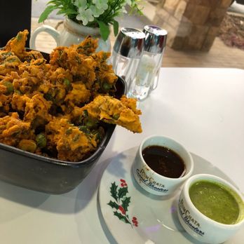 Persis Indian Grill - Mixed vegetable pakora (fried vegetable fritters) with two dipping sauces - Indian Near Me - Cookeville, Tennessee Persis Indian Grill - Mixed vegetable pakora (fried vegetable fritters) with two dipping sauces - Indian Near Me - Cookeville, Tennessee