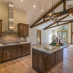 Williams Cabinets - Rustic Alder kitchen in Truckee / Tahoe with custom beam timber truss & mantle