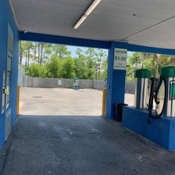 Beachy Clean Car Wash - Front vacuums, vending and tokens wall, and rear vacuum in the distance. 7/2/2024