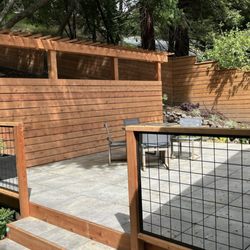 Misty Morning Gardens - Porcelain paver patio with contemporary redwood surround and welded wire railing