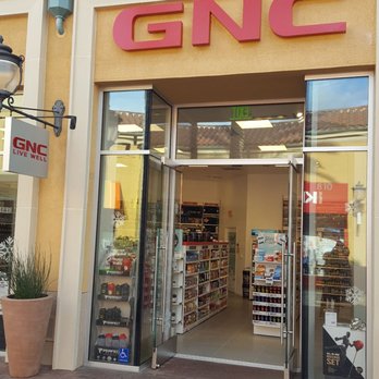 GNC - the entrance to a store in a mall - Vitamins & Supplements Near Me - Irvine, California