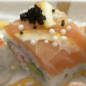 Sushi Yo - This is a close-up picture of the top of a piece of my salmon lemon roll. - Sushi Bars Near Me - Sacramento, California Sushi Yo - This is a close-up picture of the top of a piece of my salmon lemon roll. - Sushi Bars Near Me - Sacramento, California