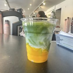 Iced mango matcha latte with oat milk