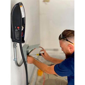 Living Kit - a man in a blue shirt working on a wall mounted heater - Furniture Stores Near Me - Burbank, California Living Kit - a man in a blue shirt working on a wall mounted heater - Furniture Stores Near Me - Burbank, California