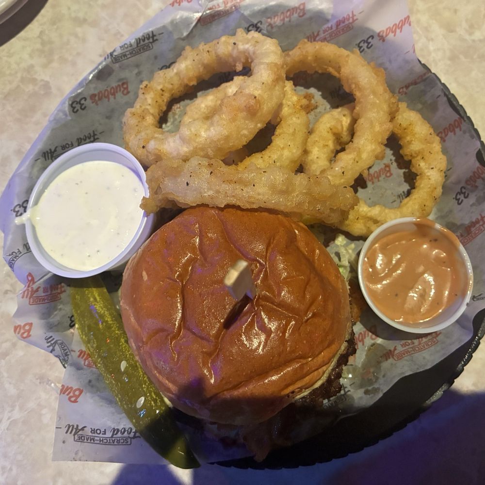 Bubba's 33 - Blackened Bleu Burger* and onion rings. Rings were great. Crisp onions nice batter - Sports Bars Near Me - Louisville, Kentucky