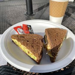 Caspian - Avocado, egg, and cheese sandwich and hot coffee with cream I guess