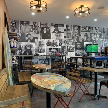 Magique Café - a man sitting at a table - Cafes Near Me - Montreal, Quebec Magique Café - a man sitting at a table - Cafes Near Me - Montreal, Quebec