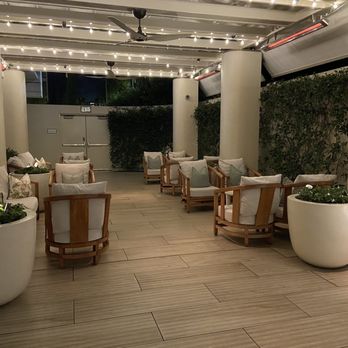 Espelette - a patio with a lot of furniture - Mediterranean Near Me - Beverly Hills, California Espelette - a patio with a lot of furniture - Mediterranean Near Me - Beverly Hills, California