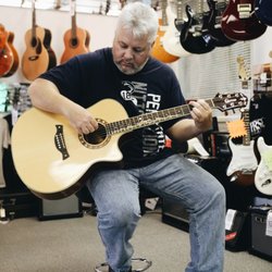 York Music Shop - We're happy to share another photo of a happy customer, Randy, with his tuned up guitar. Sounds like a dream!