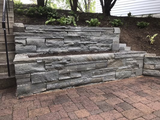 Retaining wall installation - Grading and garden planters. Retaining wall installation - Grading and garden planters.