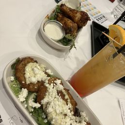 Fried Green Tomatoes and Chicken Wings nestling a rum punch
