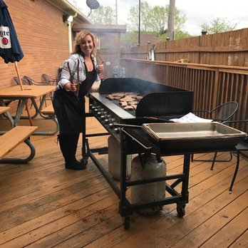 Papa Don's Pub - a woman cooking on a grill - American Near Me - Akron, Ohio