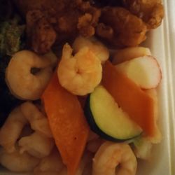 Asian Buffet - Closeup of seafood special. Shrimp, crab, and a few vegetables
