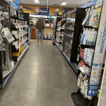 Pilot Travel Center - a man walking down the aisle of a store - Gas Stations Near Me - Corbin, Kentucky Pilot Travel Center - a man walking down the aisle of a store - Gas Stations Near Me - Corbin, Kentucky