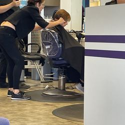 Supercuts - Hair stylist doing her thing.