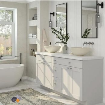 Bison Building Solutions - a bathroom with a tub, sink, and mirror - Flooring Near Me - Nashville, Tennessee Bison Building Solutions - a bathroom with a tub, sink, and mirror - Flooring Near Me - Nashville, Tennessee
