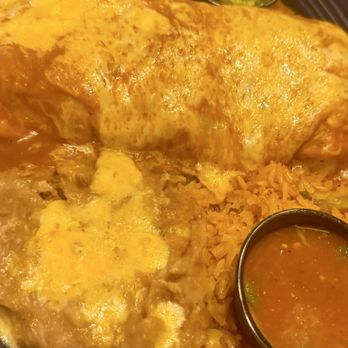 Las Casuelas Nuevas - Wet carne asada burrito with rice and beans. - Mexican Near Me - Rancho Mirage, California Las Casuelas Nuevas - Wet carne asada burrito with rice and beans. - Mexican Near Me - Rancho Mirage, California