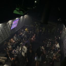 a crowd of people sitting at tables