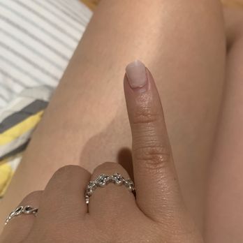 Nina's Nails - We had to cut this ourselves because it was coming off and completely broke her nail in half from underneath. - Day Spas Near Me - Lincolnwood, Illinois