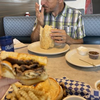 Old Town Station Restaurant - a man eating a sandwich and fries - Diners Near Me - Union Gap, Washington Old Town Station Restaurant - a man eating a sandwich and fries - Diners Near Me - Union Gap, Washington