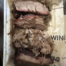 Supposed to be pork and beef burnt ends and ribs.... Clearly that's pulled pork, sliced brisket and dry ass ribs