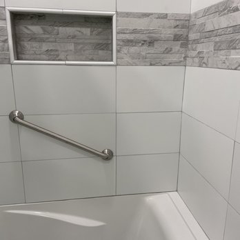 Pacific Creations - a bathtub with a hand rail - Cabinetry Near Me Pacific Creations - a bathtub with a hand rail - Cabinetry Near Me