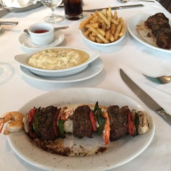 Ruth's Chris Steak House - Petite Filet & Shrimp with a side of mashed potatoes & a New York Strip cooked medium well with a side of fries. - Steakhouses Near Me - Cancún, ROO