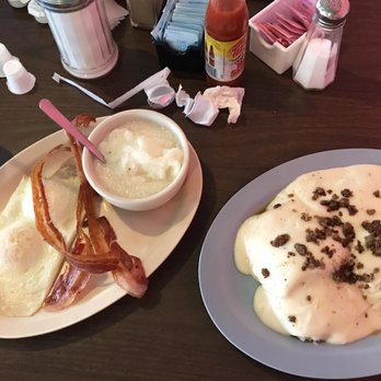 Pennyman's Diner - Breakfast of grits, eggs, crispy bacon, biscuit and gravy with sausage crumbles on top. - Breakfast & Brunch Near Me - Johnson City, Tennessee Pennyman's Diner - Breakfast of grits, eggs, crispy bacon, biscuit and gravy with sausage crumbles on top. - Breakfast & Brunch Near Me - Johnson City, Tennessee