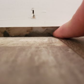 No Limits Construction and Restoration - a person's finger on a wood floor - General Contractors Near Me No Limits Construction and Restoration - a person's finger on a wood floor - General Contractors Near Me