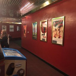 The entrance of The theatre with posters of new and vintage foreign films.