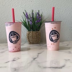 Boise Boba - Two Straw-horchata's one with passion fruit poppers the other with strawberry poppers. Both size gucci (24 fl oz)