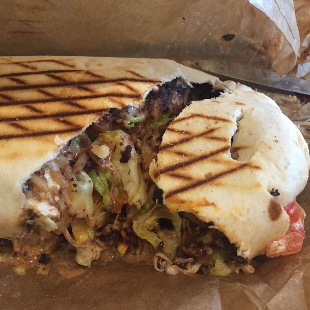 Jim Burrito - Inside of chorizo burrito - bits of chorizo, lettuce, diced tomatoes, red onions, rice, black beans and sour cream - Mexican Near Me - Hamburg, HH Jim Burrito - Inside of chorizo burrito - bits of chorizo, lettuce, diced tomatoes, red onions, rice, black beans and sour cream - Mexican Near Me - Hamburg, HH