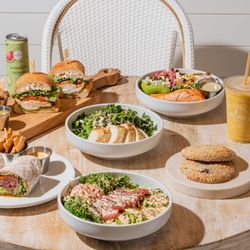 Pura Vida Miami - Fresh and healthy table spread featuring vibrant salads, nutritious bowls and wraps, all-day breakfast favorites, superfood s...