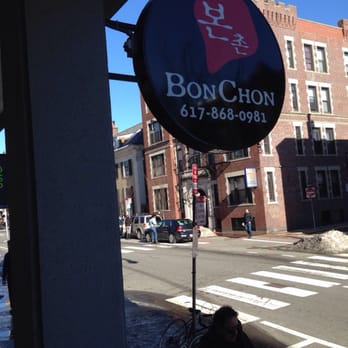 Bonchon Cambridge - John F Kennedy St - Storefront sign. The restaurant is in the lower level. - Korean Near Me - Cambridge, Massachusetts Bonchon Cambridge - John F Kennedy St - Storefront sign. The restaurant is in the lower level. - Korean Near Me - Cambridge, Massachusetts