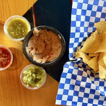 Rica Cocina - Chips served with frijoles - sauces on the salsa bar are great. The roja is fresh & spicy, but not too ! - Mexican Near Me - Olympia, Washington Rica Cocina - Chips served with frijoles - sauces on the salsa bar are great. The roja is fresh & spicy, but not too ! - Mexican Near Me - Olympia, Washington