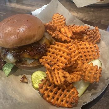 Goog’s Pub & Grub - Burbonator burger with sweet potato fries - Burgers Near Me - Holland, Michigan Goog’s Pub & Grub - Burbonator burger with sweet potato fries - Burgers Near Me - Holland, Michigan