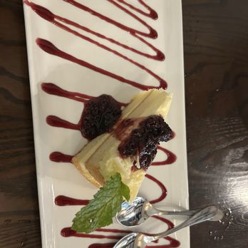 Il Porto Di Venezia - Senoia - Lemon cello with blackberry sauce cake - Italian Near Me - Senoia, Georgia Il Porto Di Venezia - Senoia - Lemon cello with blackberry sauce cake - Italian Near Me - Senoia, Georgia