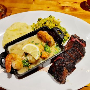 Fahrenheit 132 - Surf and turf with shrimp scampi, rosemary mashed potatoes, and shaved Brussels sprouts. - Steakhouses Near Me - Fredericksburg, Virginia Fahrenheit 132 - Surf and turf with shrimp scampi, rosemary mashed potatoes, and shaved Brussels sprouts. - Steakhouses Near Me - Fredericksburg, Virginia