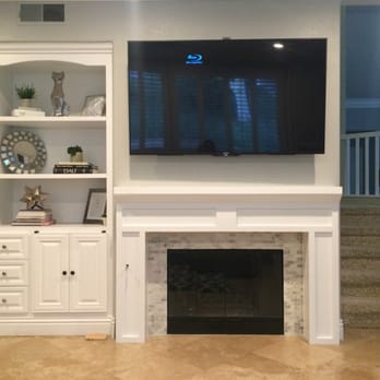 FAB Construction - FAB installed our new mantle, tiled the surround, and even painted the inside of the fireplace and the outdated brass on the glass door. - Windows Installation Near Me