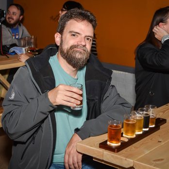 Vortex Alley Brewing - a man sitting at a table with beer glasses in front of him - Breweries Near Me - Ponca City, Oklahoma Vortex Alley Brewing - a man sitting at a table with beer glasses in front of him - Breweries Near Me - Ponca City, Oklahoma