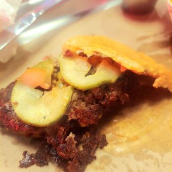 Burger Schmurger - The bun came flat like this, and you can see grill scrapings on the meat. - Burgers Near Me - Dallas, Texas