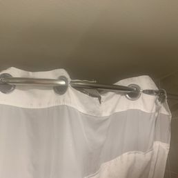 Ripped shower curtain