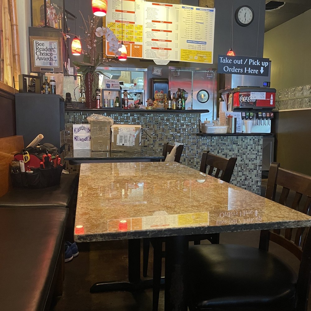 a table and chairs in a restaurant a table and chairs in a restaurant