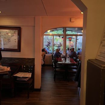 España Restaurant & Tapas - View of the indoor seating in the main building and garden view - Spanish Near Me - Fernandina Beach, Florida España Restaurant & Tapas - View of the indoor seating in the main building and garden view - Spanish Near Me - Fernandina Beach, Florida