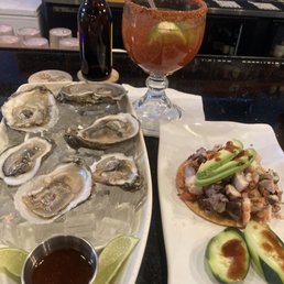 Michelada, oysters, tostada de pulpo