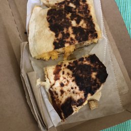 Chicken quesadilla. Didn't check our to go order before we left and it was burned. Not good at all!!! Chicken quesadilla. Didn't check our to go order before we left and it was burned. Not good at all!!!